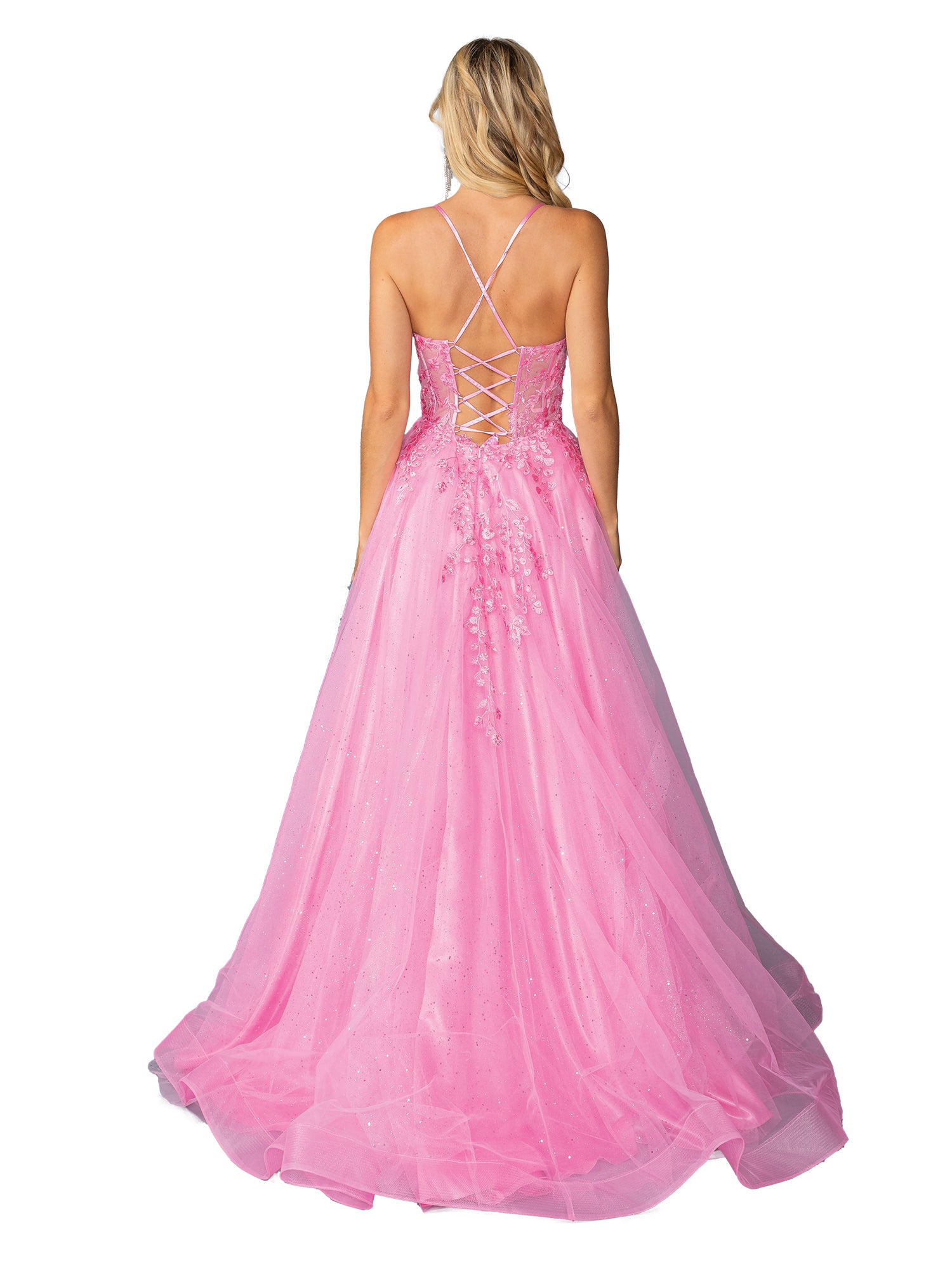 Woman in the Lace-Up Long Tulle Prom Ball Gown 4421, a pink floor-length dress with a lace-up back and floral embellishments, stands facing away from the camera.